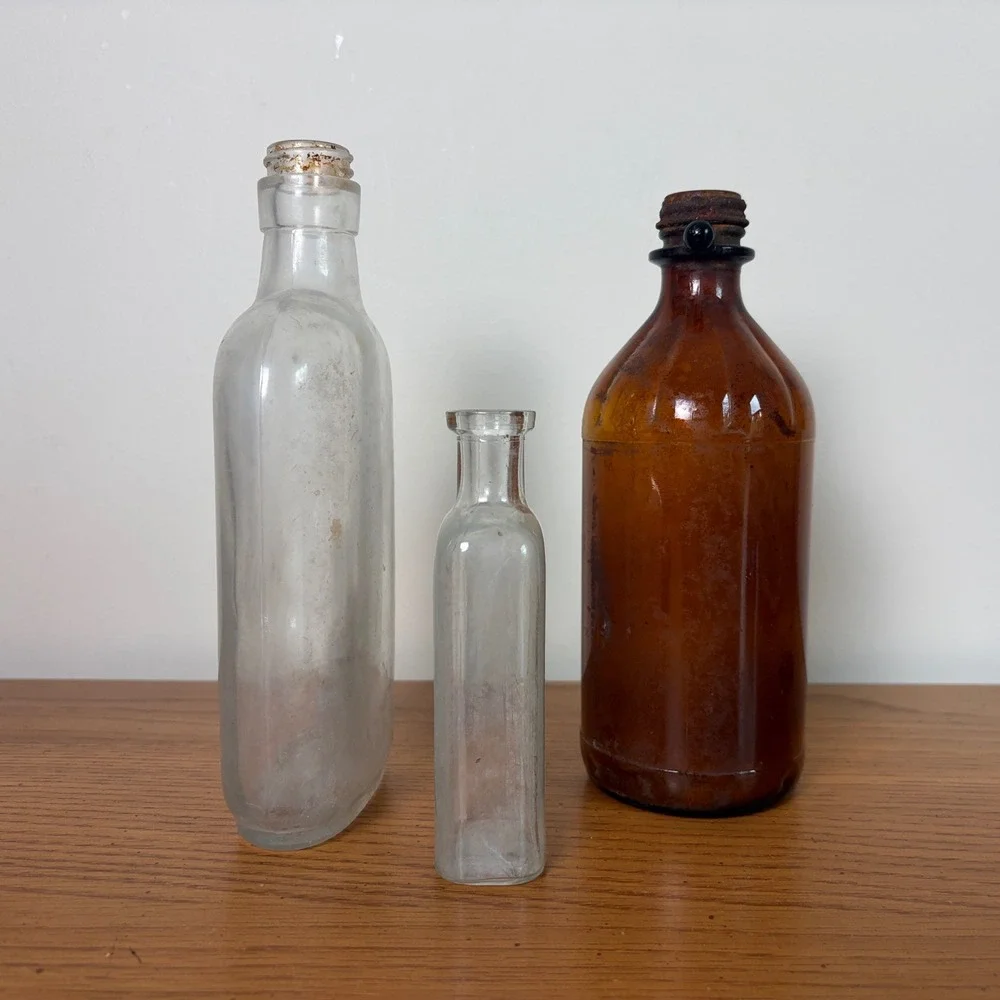 Vintage Glass Bottle Trio Amber and Clear Apothecary Medicine Bottles Set of 3
